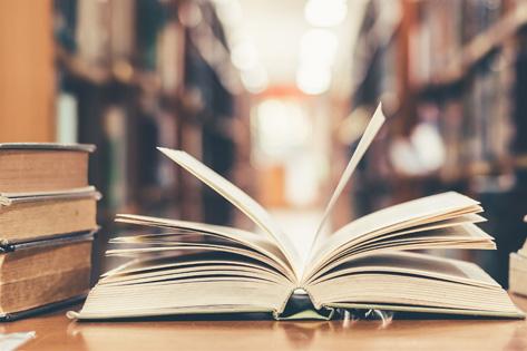 Picture of a library with an open book symbolizing Practice Resources used as the thumbnail